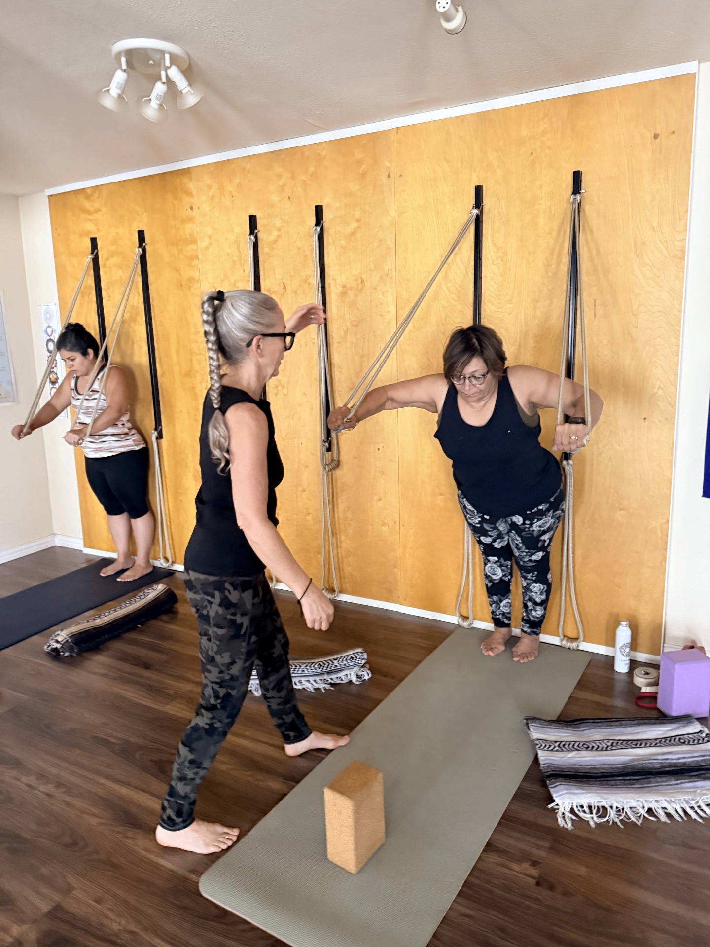 Students working with the rope wall during class at Blue Anjou