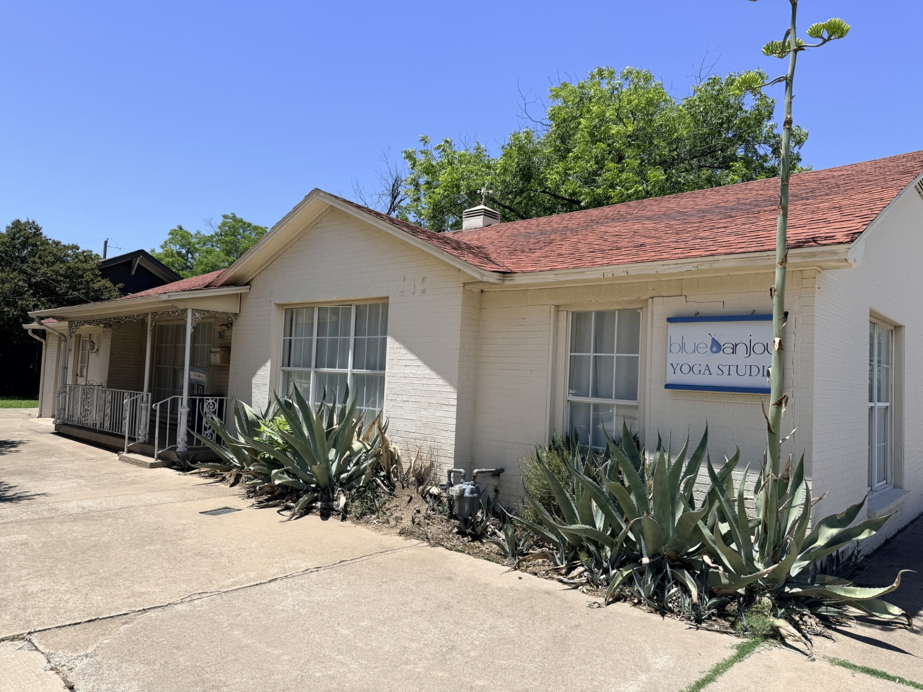 Front exterior of Blue Anjou Yoga Studio in Lewisville