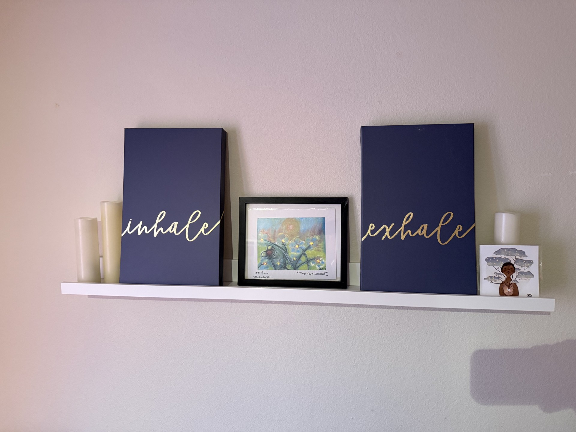 Inhale and exhale shelf display inside Blue Anjou Yoga Studio